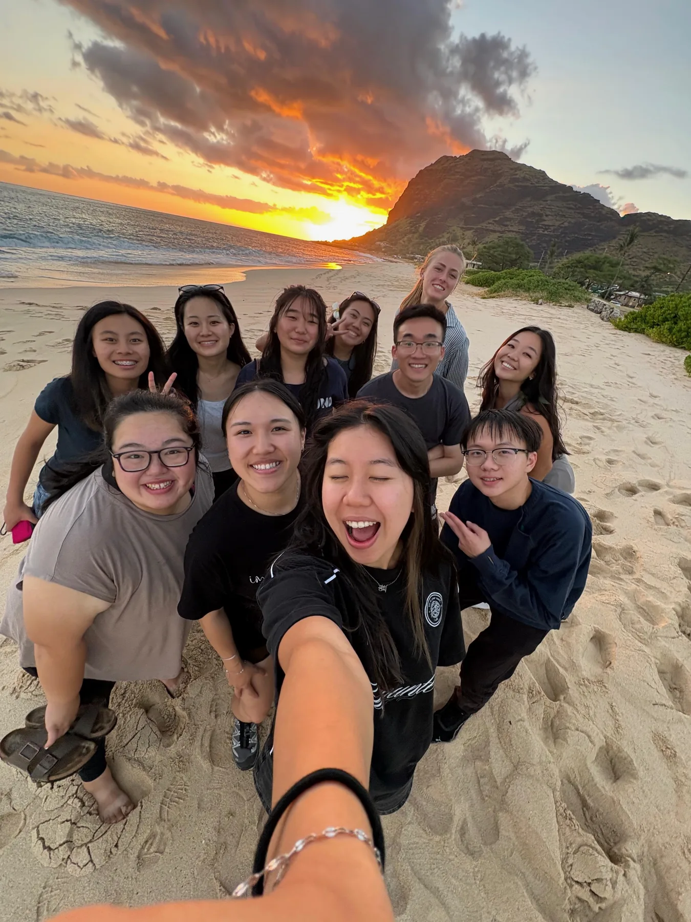 Team selfie on the beach during the first sunset on the Waiʻanae coast.
