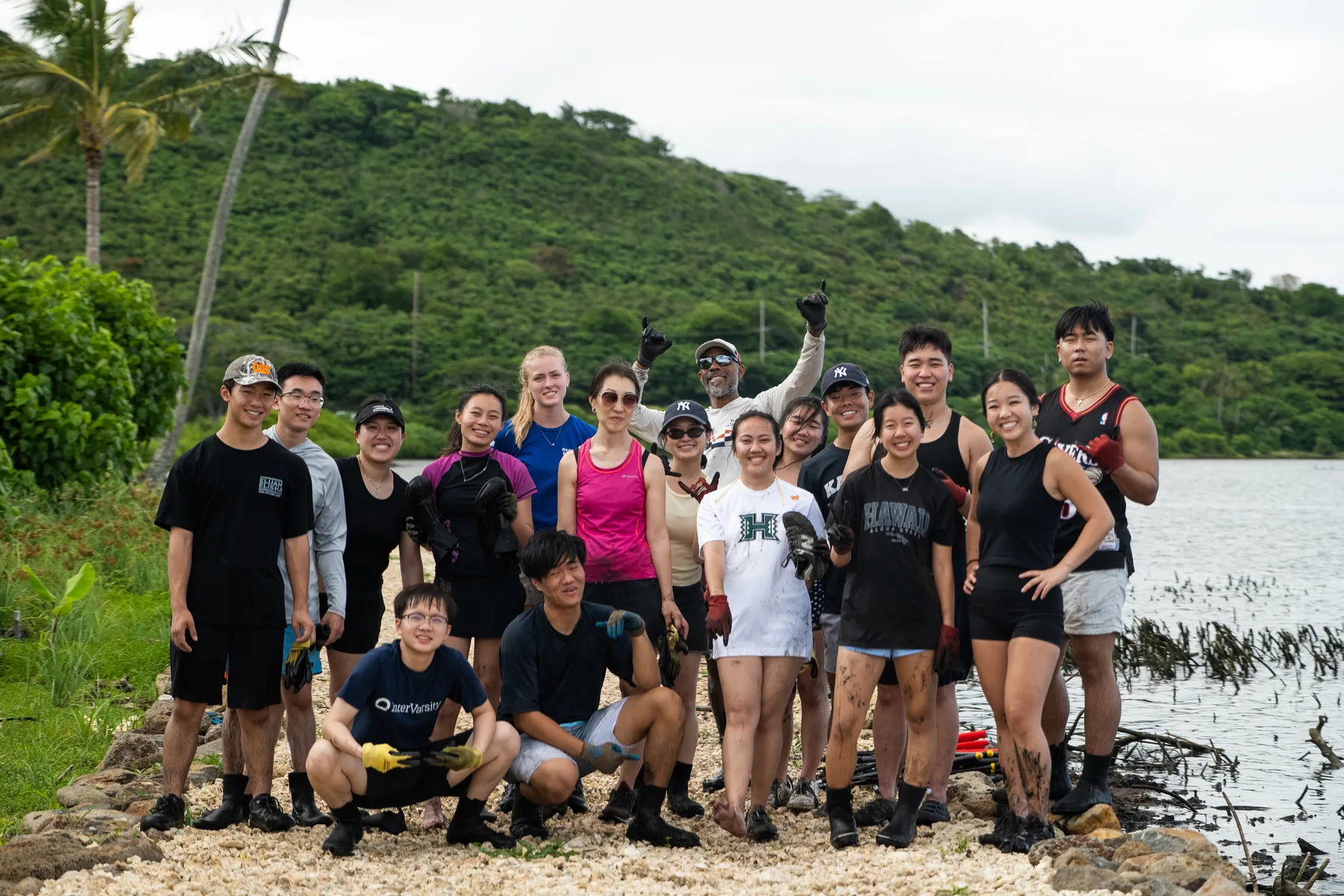 The team standing together on the edge of Heʻeia Fishpond.