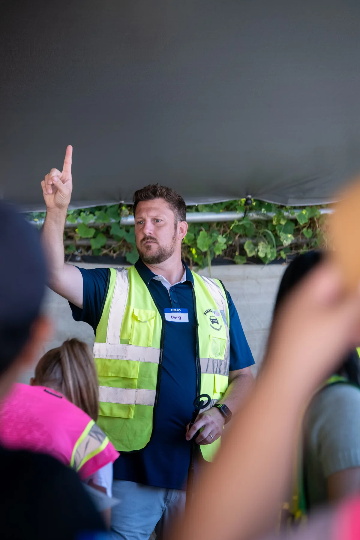A volunteer leader briefing the team during the food drive.
