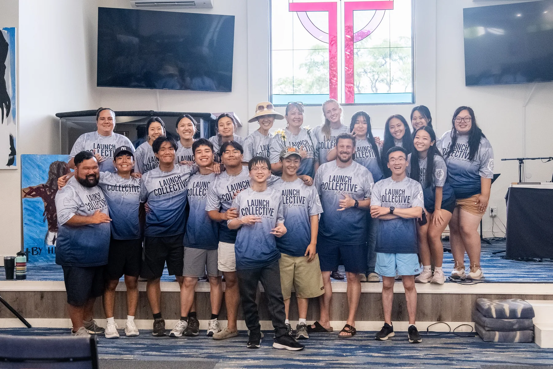 Team photo with Pastor Abby after shoe sorting.